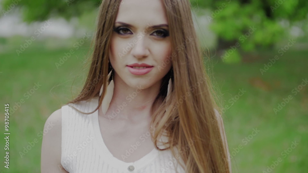 Beautiful woman with green eyes and brown hair goes to the camera slow motion Beautiful woman with green eyes and brown hair goes to the camera slow motion