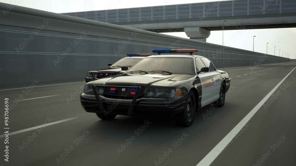 Two police cars chase. The vehicles are involved in the urgent pursuit. Two police cars chase. The vehicles are involved in the urgent pursuit.