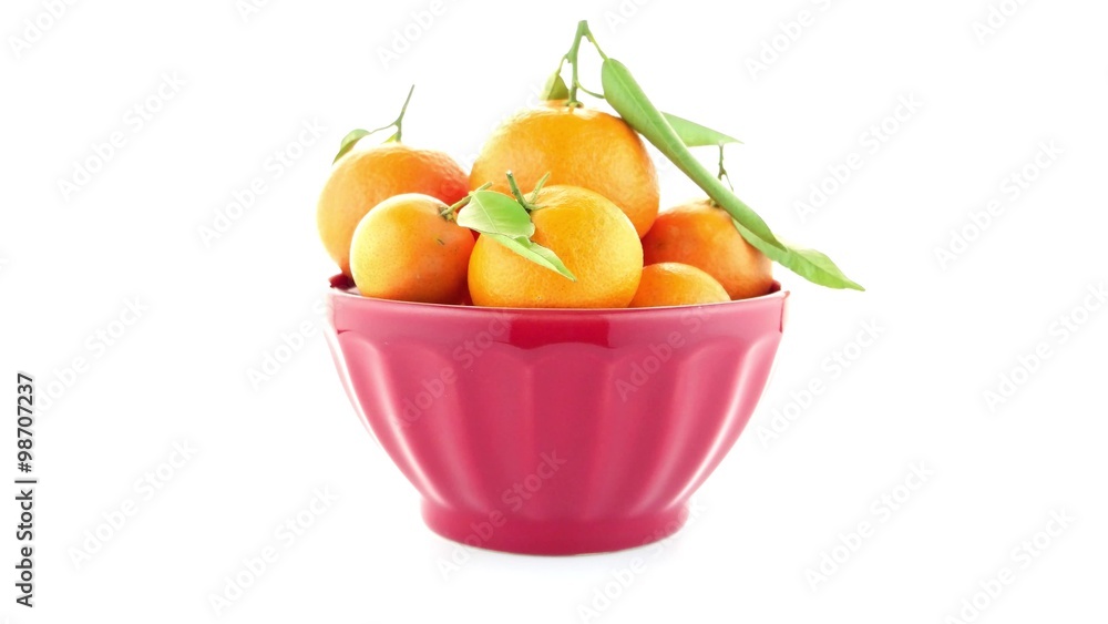 Tangerines on ceramic red bowl isolated on white background Tangerines on ceramic red bowl isolated on white background