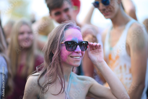 Stylish woman with perfect smile at Holi festival