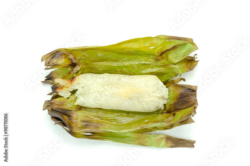 grilled sticky rice wrapped in banana leaf on background