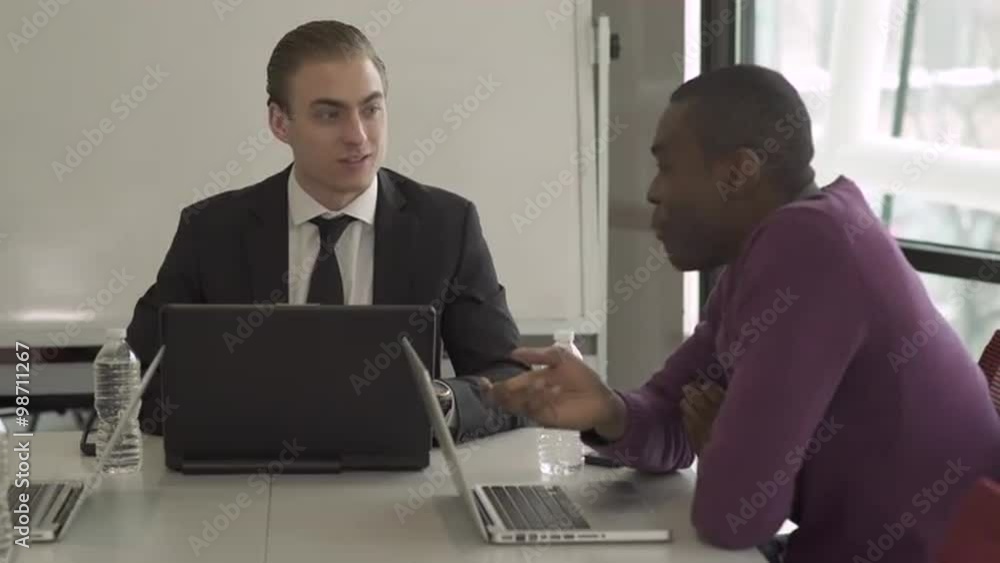 Group of attractive professionals involved in meeting Group of attractive professionals involved in meeting