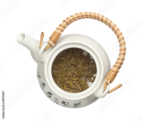 Teapot with chinese tea leaves photo