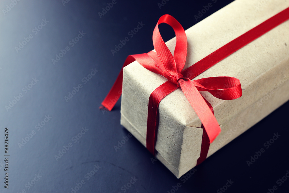 gift red bow black background gift red bow black background