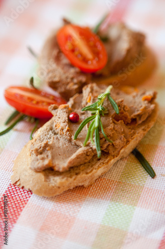 Chicken liver pate on bread with cherry tomatoes 