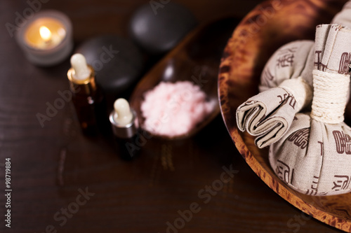 healphy bags and candles on wooden table photo