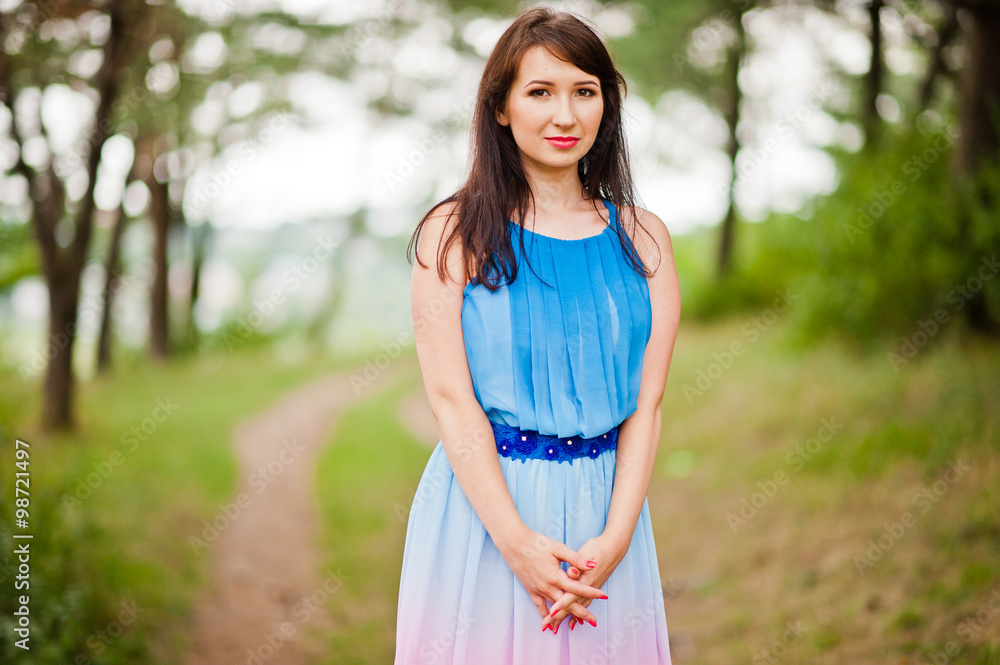 Young beautiful and cute girl posed at pine forest