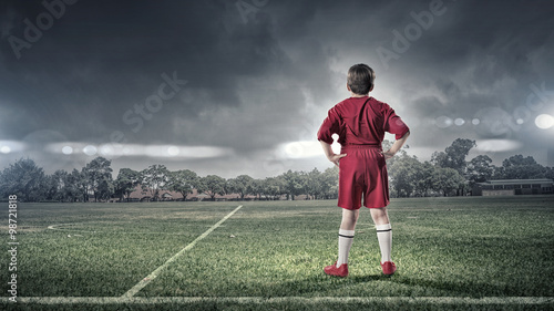 kid boy on soccer field