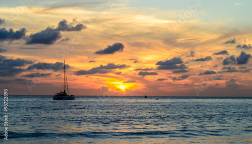 sailboat and sunset at Layan beach, Phuket in Thailand