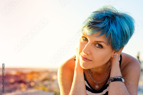 A portrait of beautiful girl with blue hair in sailor's striped