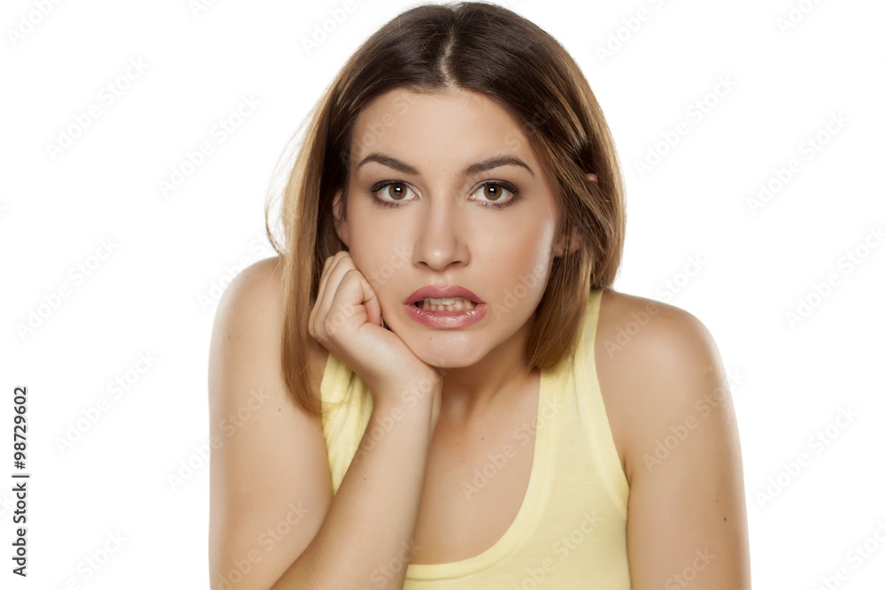 frightened beautiful young woman looking at the camera frightened beautiful young woman looking at the camera