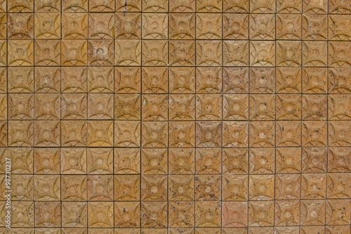 Background of old vintage carving brick wall in thailand. 