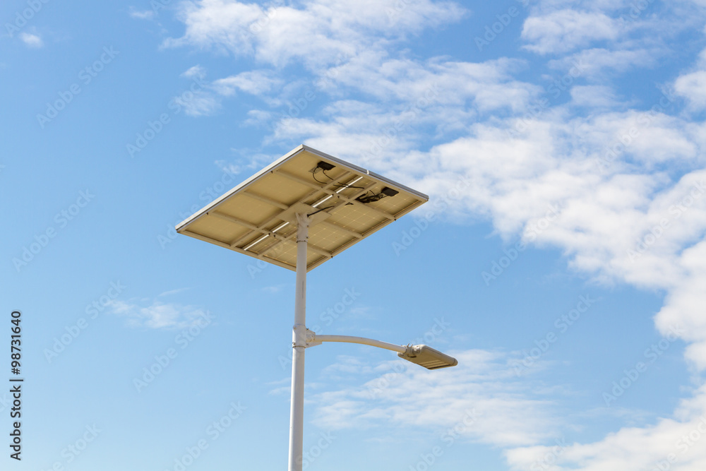 Under View - Street lights that use solar cells with blue sky Under View - Street lights that use solar cells with blue sky