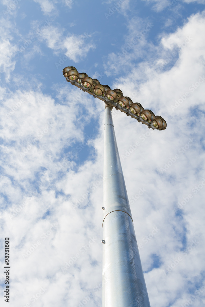 Fototapeta premium Spotlights soccer stadium with blue sky