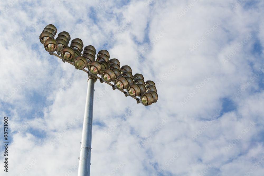 Fototapeta premium Spotlights soccer stadium with blue sky