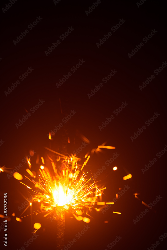 Christmas sparkler in haze with red light