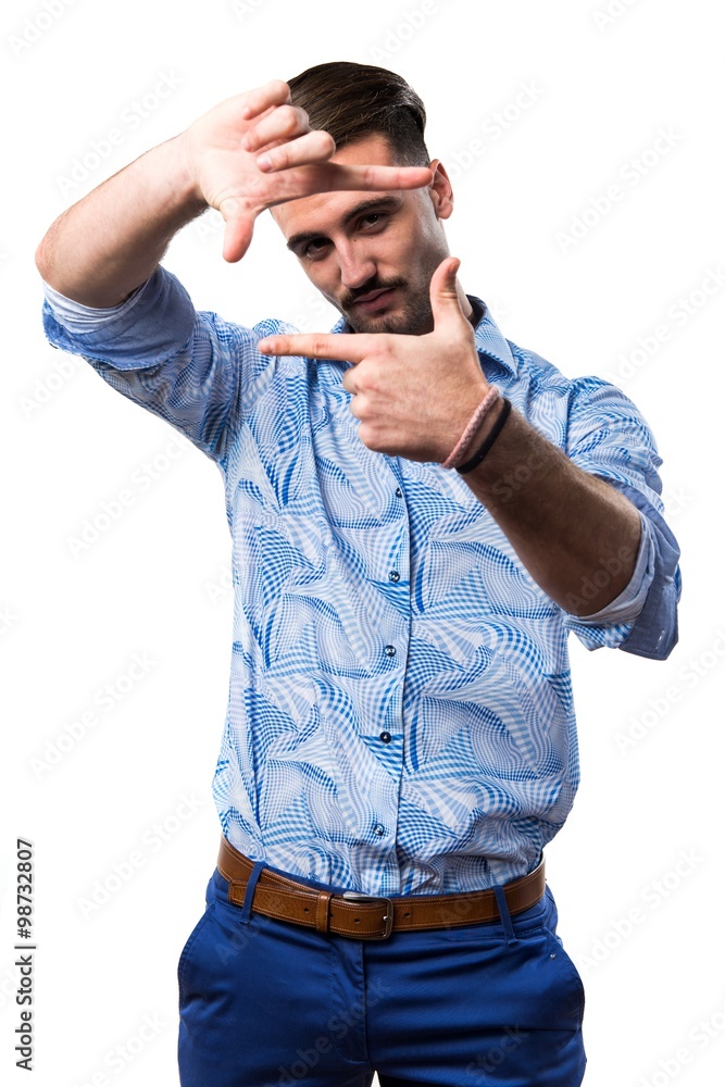 Fototapeta premium Handsome man focusing with his fingers