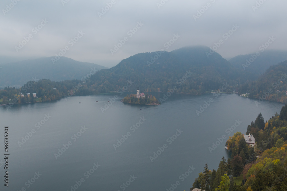 Bled, Slovenia - October 12, 2015. Bled lake with its only island in the autumnal mist.