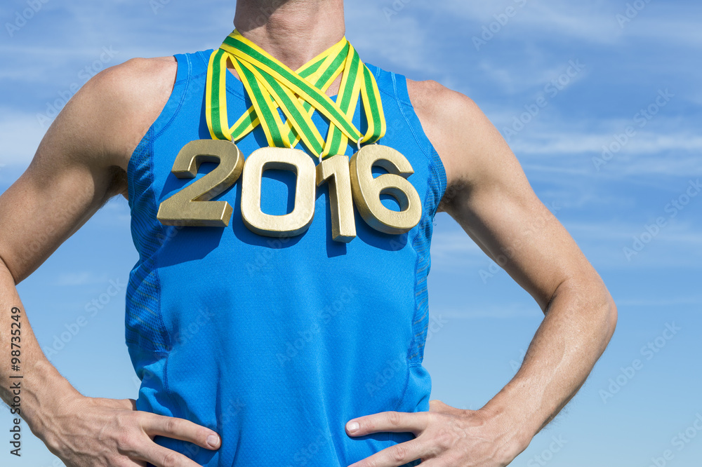 Naklejka premium Gold medal 2016 athlete standing in front of bright sunny blue sky in Rio de Janeiro, Brazil