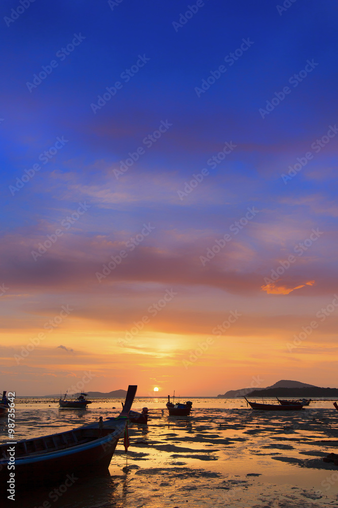 Traditional thai boats at sunset beach. Ao Nang, Krabi
