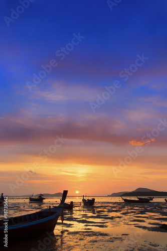 Traditional thai boats at sunset beach. Ao Nang, Krabi