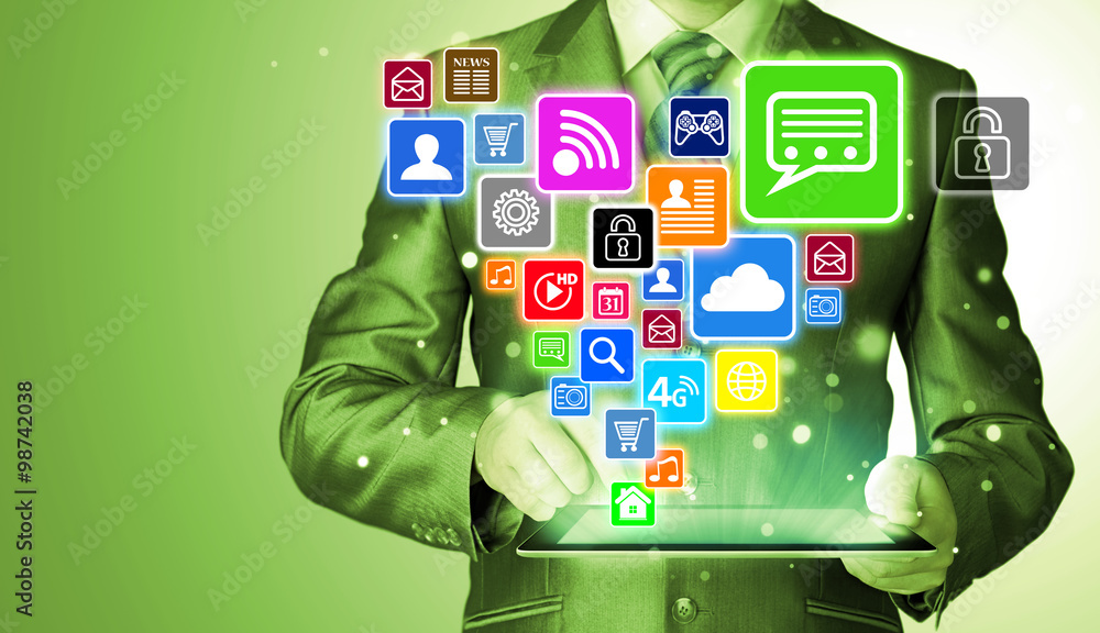 Business man using tablet PC with social media icon set Business man using tablet PC with social media icon set