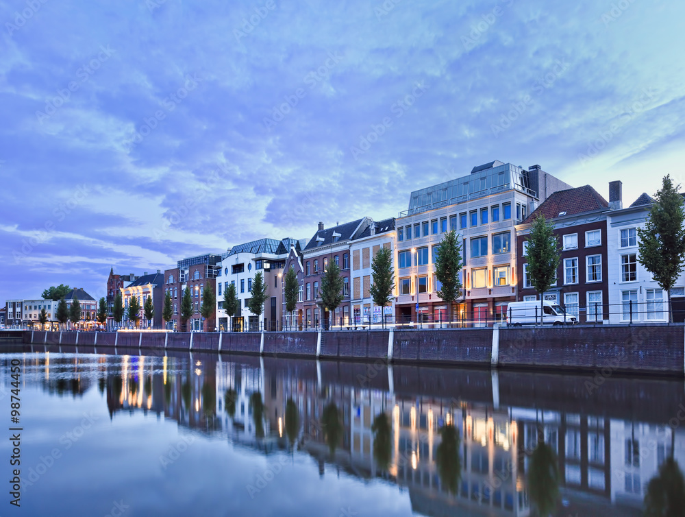 Stately mansions mirrored in a harbor at twilight, Breda, The Netherlands