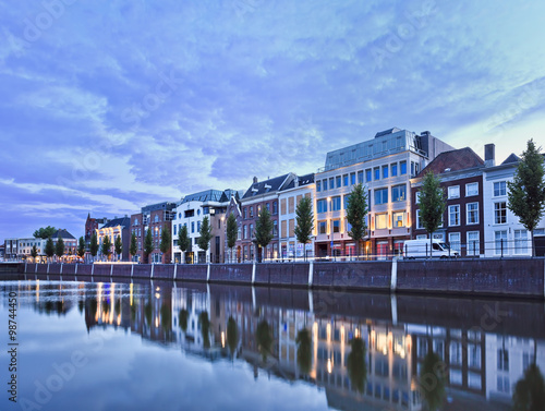 Stately mansions mirrored in a harbor at twilight, Breda, The Netherlands