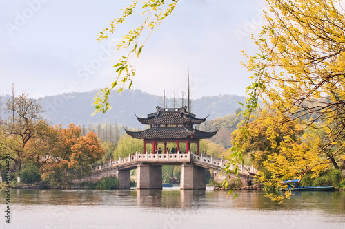 Famous bridge at enchanting West Lake in autumn colors, Hangzhou, China