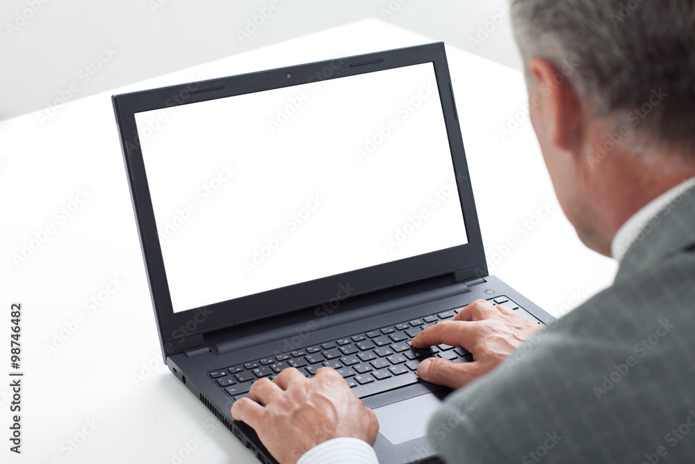 Male businessman sitting at the table isolated Male businessman sitting at the table isolated