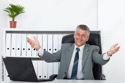Male businessman sitting at the table