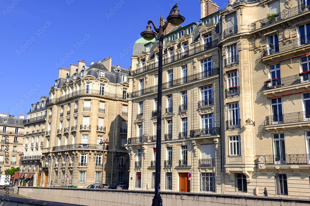 Facade of building front along Seine River in Paris, France, Western Europe