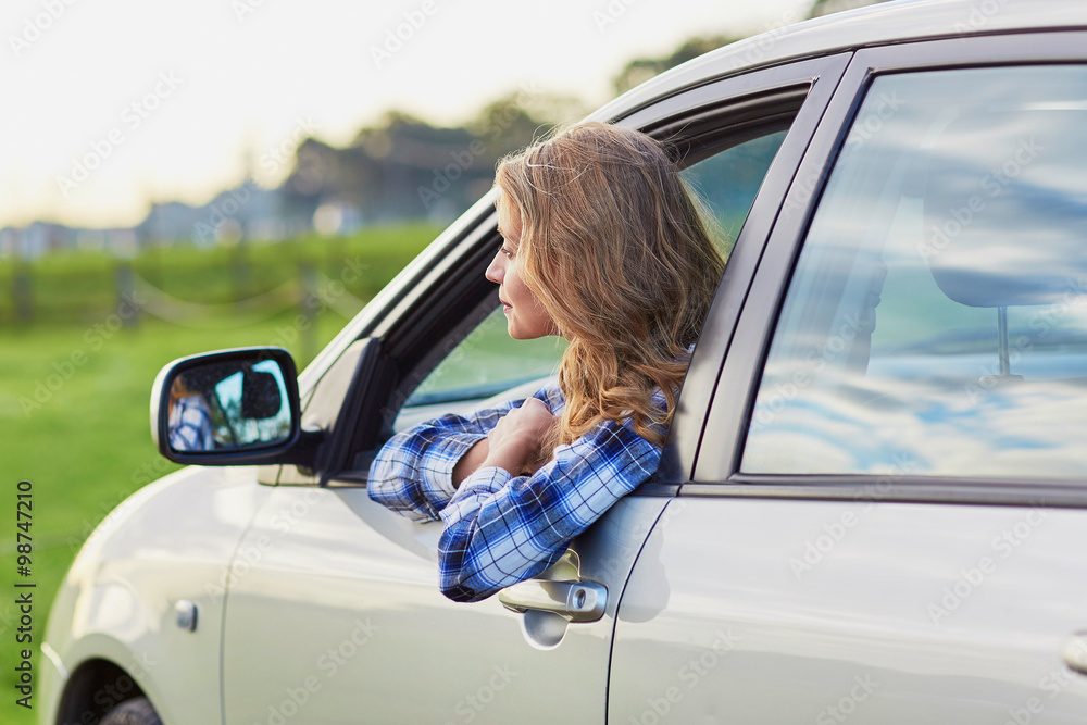 Young confident woman driving a car Young confident woman driving a car