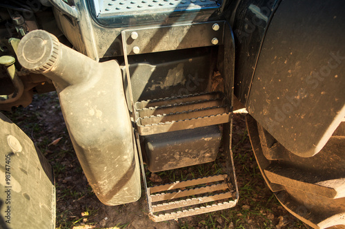 metal steps up to cultivator tractor cabin by petrol tank photo