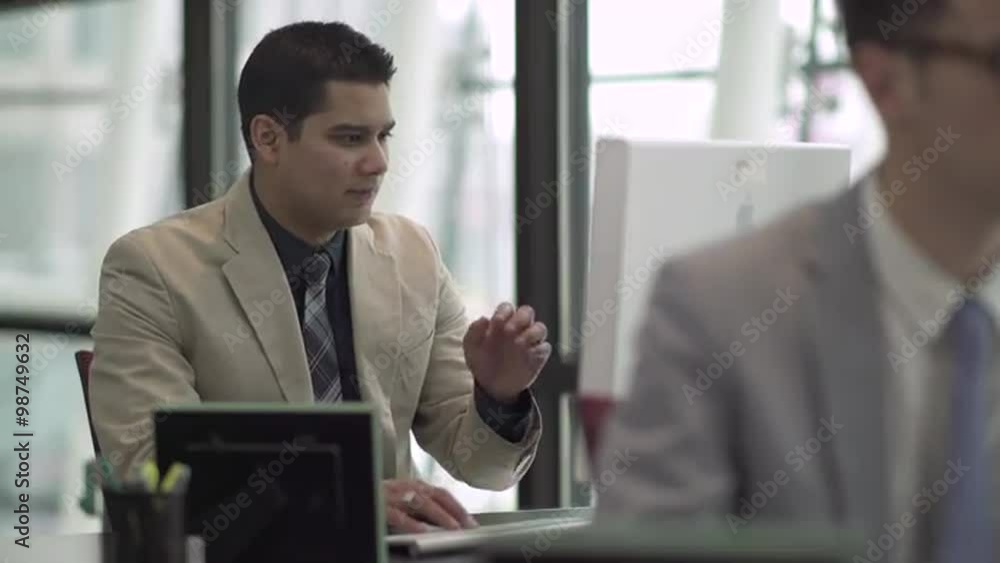 Professional in modern call center using headset and keyboard Professional in modern call center using headset and keyboard