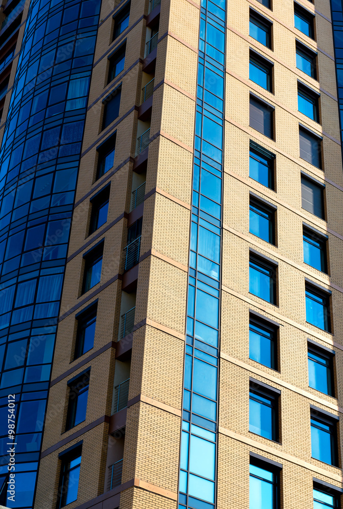 Modern building mirror facade in blue tone Modern building mirror facade in blue tone