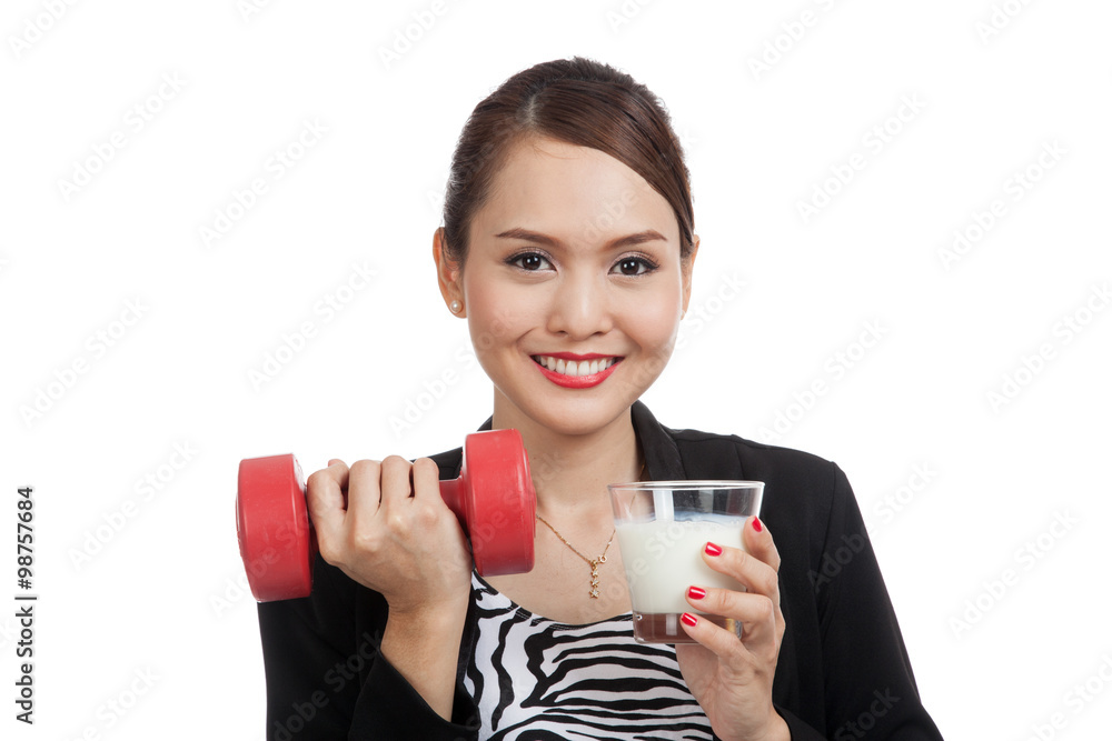 Healthy Asian woman drinking a glass of milk and dumbbell Healthy Asian woman drinking a glass of milk and dumbbell