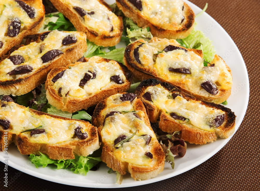 Bruschetta with olives and mozzarella Bruschetta with olives and mozzarella