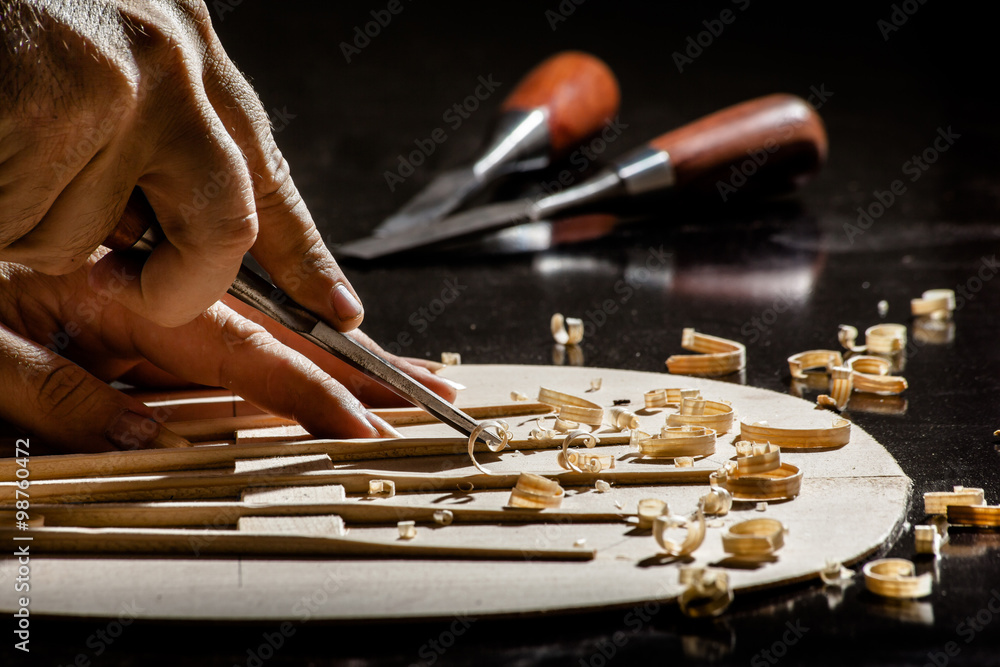 Obraz premium Luthier making top of guitar