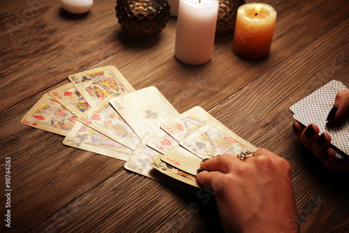 Witch - fortune teller reading fortune close up photo