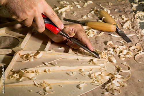 Luthier making top of guitar