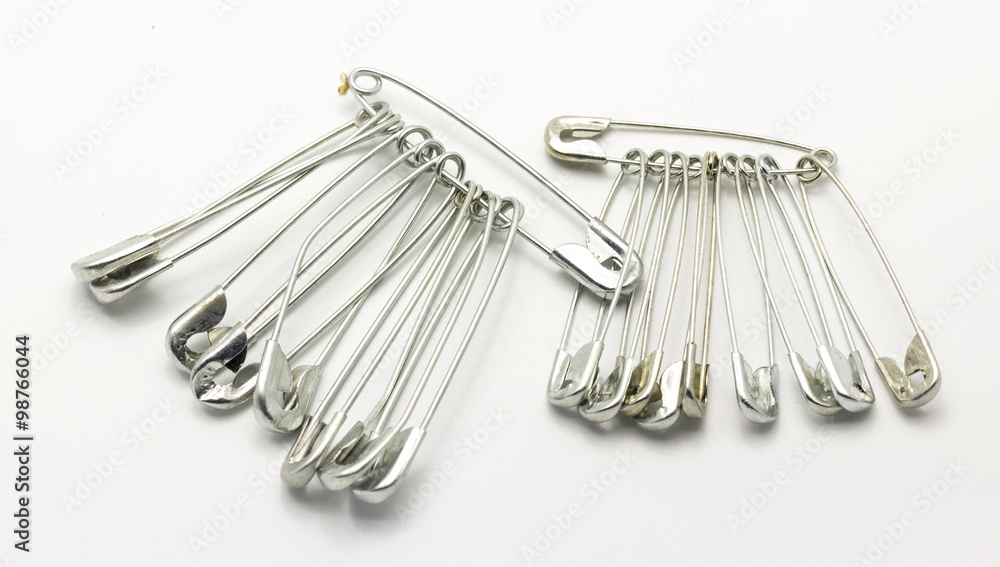 Safety pin isolated on white background Safety pin isolated on white background