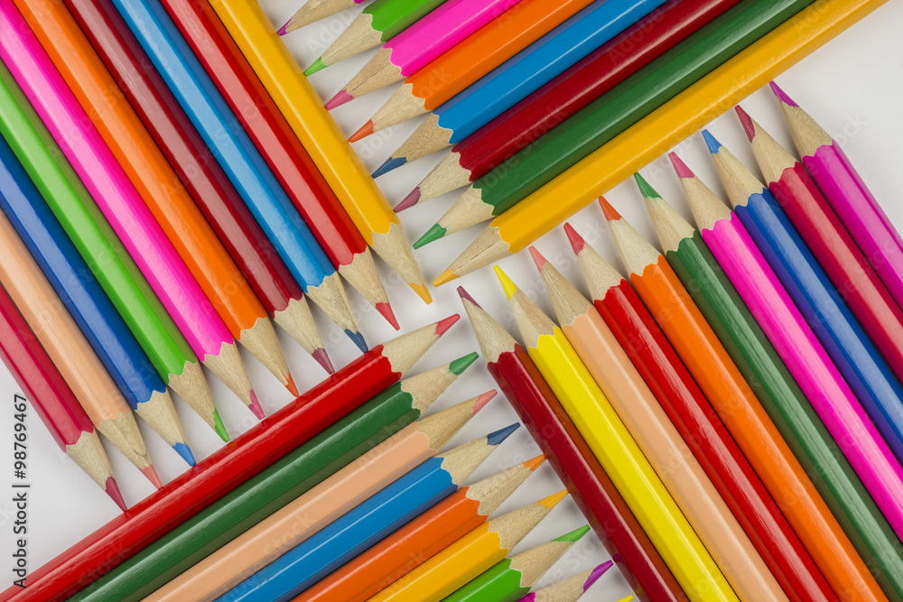 Fototapeta premium Abstract composition of a set wooden colour pencils.