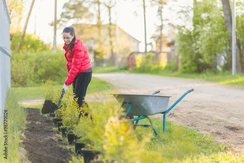 Young beautiful woman in her garden