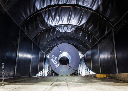 Steel coil chained down on truck bed