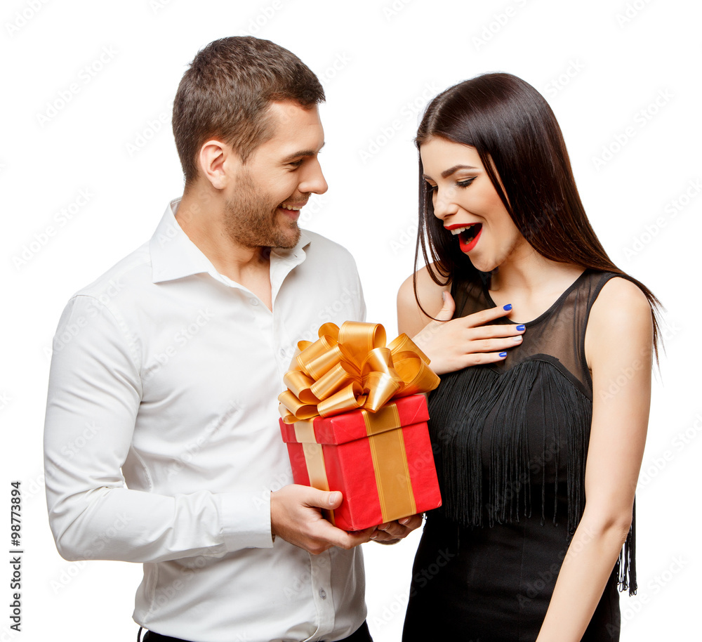Young beautiful couple with present isolated on white Young beautiful couple with present isolated on white
