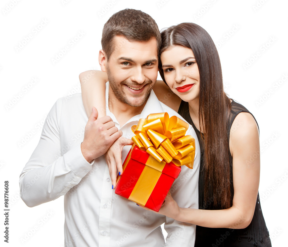 Young beautiful couple with present isolated on white Young beautiful couple with present isolated on white