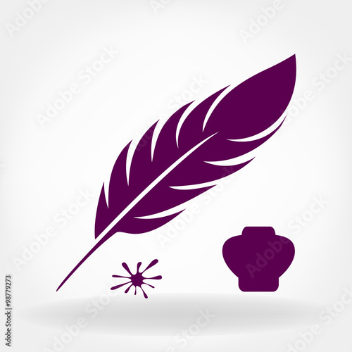 feather quill pen and inkwell