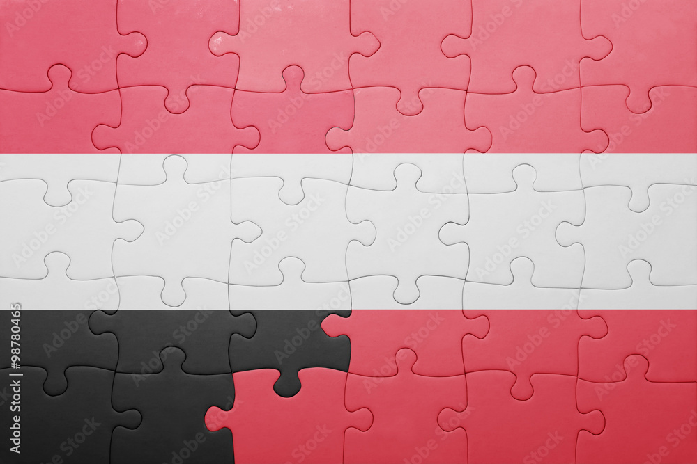 Fototapeta premium puzzle with the national flag of yemen and austria