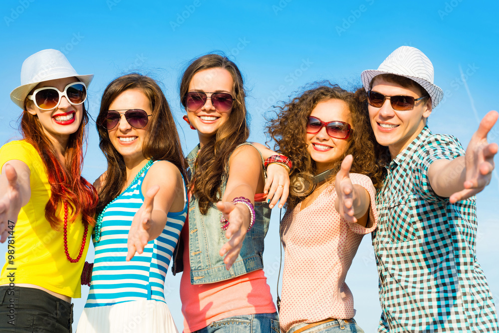 group of young people wearing sunglasses and hat group of young people wearing sunglasses and hat